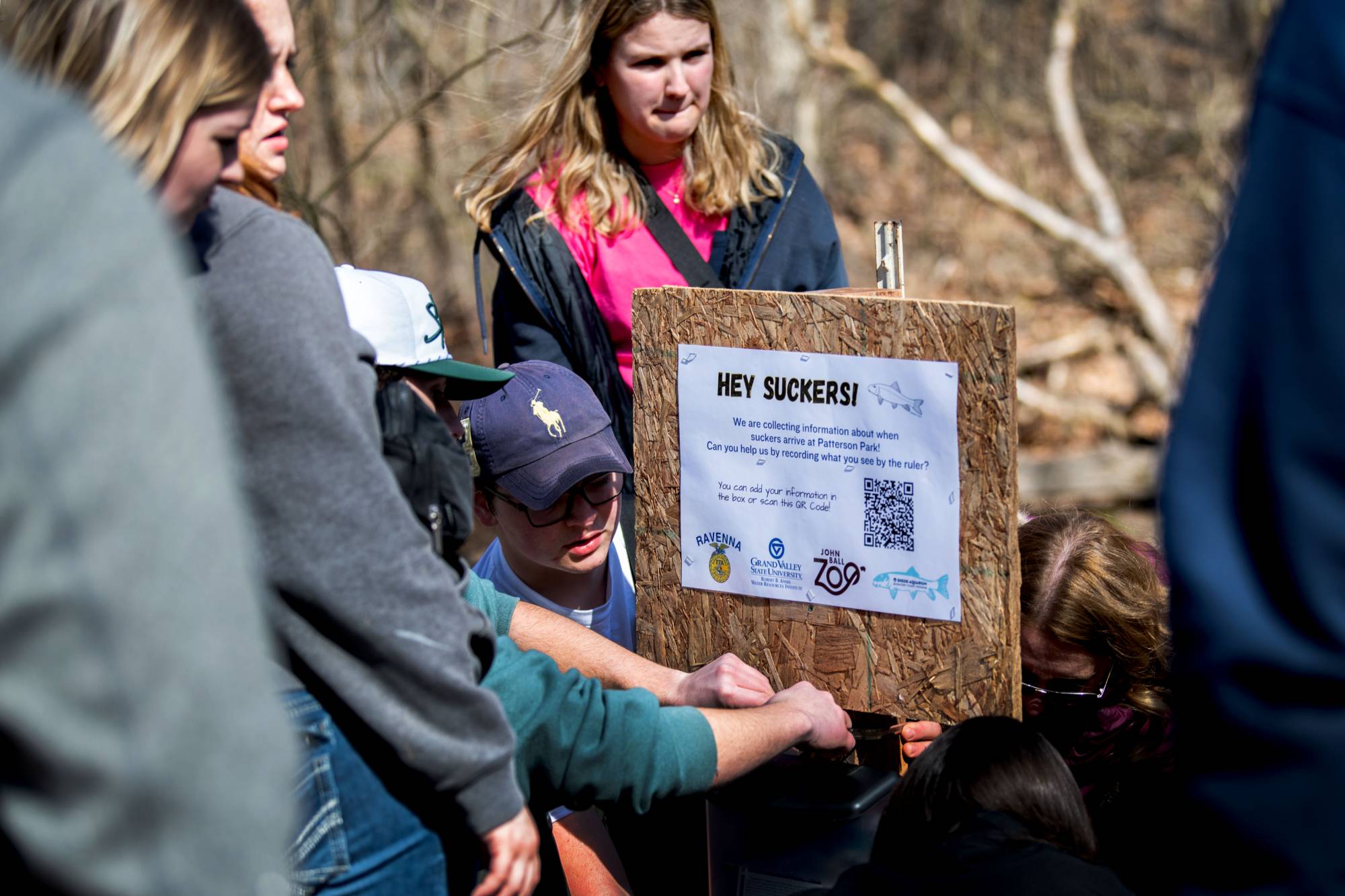 Ravenna High School students set up a sucker migration monitoring site